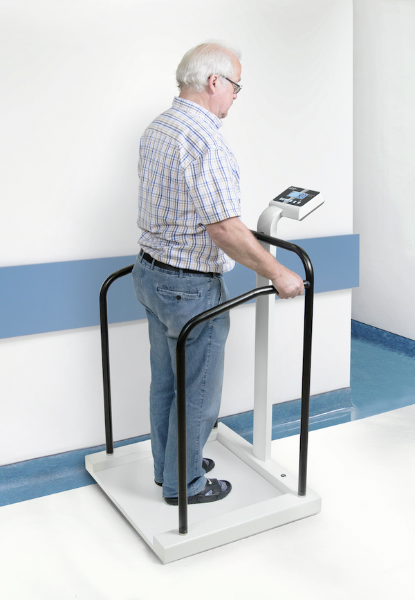 standing aid scale with patient