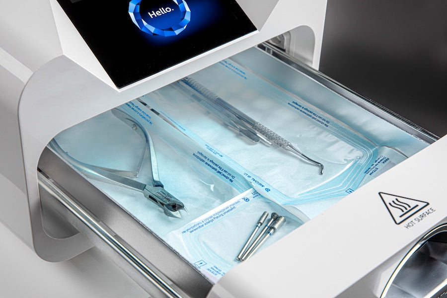 Enbio autoclave with dental instruments inside