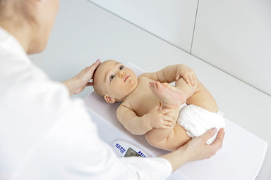 Baby Scale with baby on it