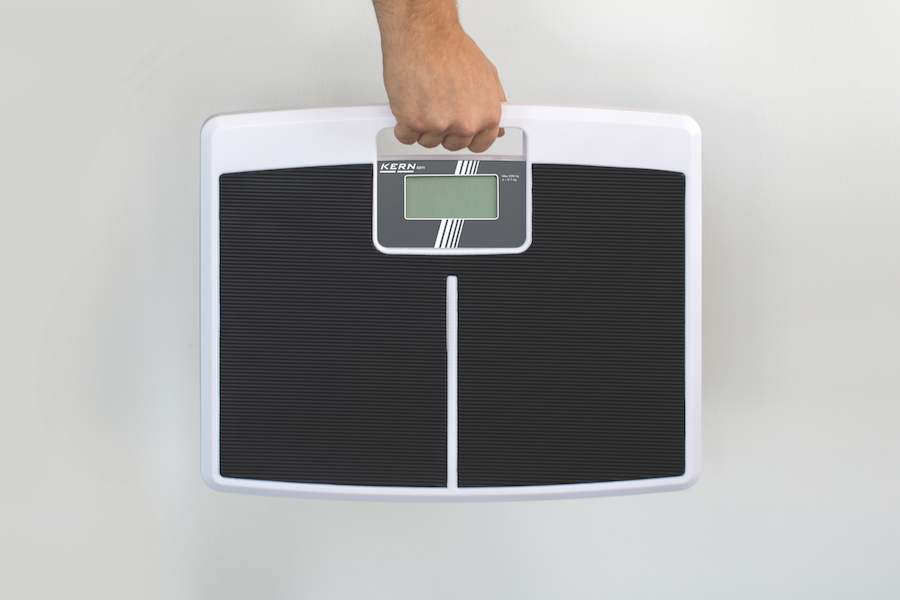 Personal Floor Scale in a hand