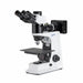 microscope with trinocular tube, large stage, and reflected light illumination system.