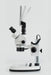 Stereo microscope with side-mounted LCD screen in tilted position.