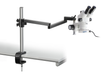 Stereo microscope with boom stand mounted to a table.